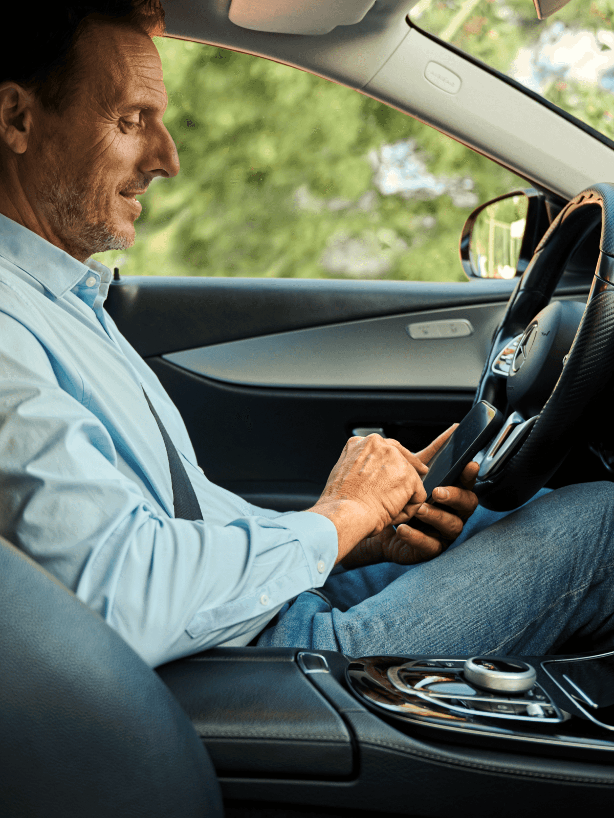 taxi driver typing on phone