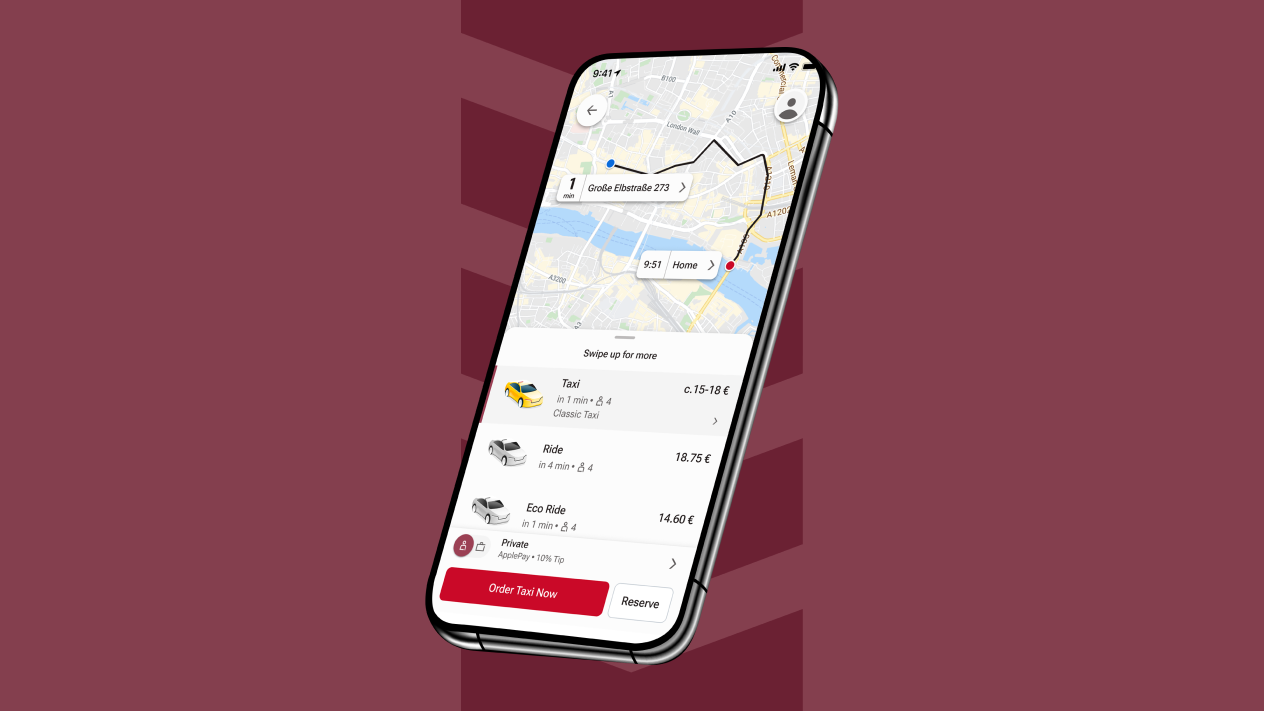 Telefono cellulare con l'applicazione FREENOW sullo schermo, dove i dipendenti possono prenotare taxi, biciclette e altre modalità di trasporto come parte dei loro benefit per i dipendenti.