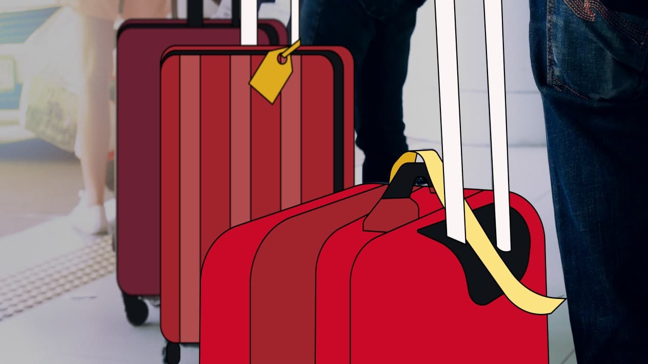 people dragging two suitcases